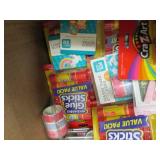 box of mostly packages of glue stic...