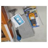 lot of storage items and stud finde...