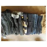 Collection of gloves, scarves, vest and a bag