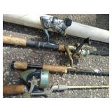 Large Collection of Fishing Poles and Reels