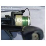 Large Collection of Fishing Poles and Reels