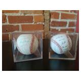 2 signed baseballs