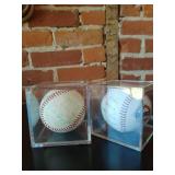 2 signed baseballs