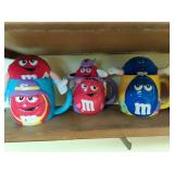 Collection of M & M cups with plush toys