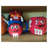 Collection of M & M cups with plush toys