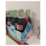 Two Six Packs of Coca-Cola Bottles