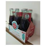 Two Six Packs of Coca-Cola Bottles