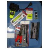 wire stripping electrical kit, metal flashlight, battery tester, and chirper and outlet tester and remote control