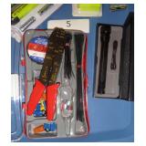 wire stripping electrical kit, metal flashlight, battery tester, and chirper and outlet tester and remote control