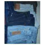 12 pair of womens jeans size 12 and 14, includes Lee, Levis, LL Bean, a couple are insulated, all in very good condition