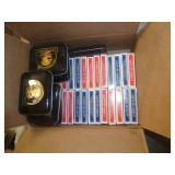 37 decks of cards and 8 tin boxes to store decks in