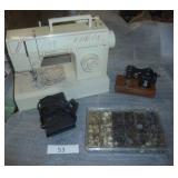 working Singer sewing machine with various stitches, a container full of buttons sorted by color, and a play holly hobbie sewing machine