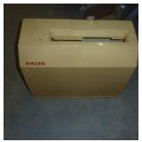 working Singer sewing machine with various stitches, a container full of buttons sorted by color, and a play holly hobbie sewing machine