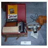 Old Kodak instant camera and a 35mm SLR with nice leather case