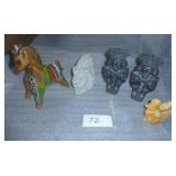 a somewhat ecclectic group,  metal horse bank, stone face and stone bird, not sure if the bookends are stone or resin