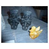 a somewhat ecclectic group,  metal horse bank, stone face and stone bird, not sure if the bookends are stone or resin
