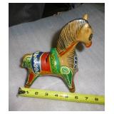 a somewhat ecclectic group,  metal horse bank, stone face and stone bird, not sure if the bookends are stone or resin