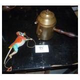 a couple of unique collectibles, teapot with a side handle and a tin climbing monkey
