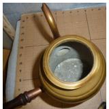 a couple of unique collectibles, teapot with a side handle and a tin climbing monkey