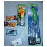 3 new fishing lures, a hook remover, and bobbers