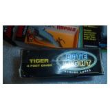 3 new fishing lures, a hook remover, and bobbers
