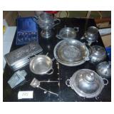 lot of vintage silverplate serving dishes, most of them are quadruple plate, and a set of silver spoons and a tin with a pewter rabbit scene