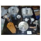 vintage kitchen stuff, angel food cake pans, one square and one round, tin cups, flour sifter, grinder, knife rack and tea pot