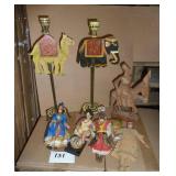 Lot of unique international items, 2 tall metal candle holders, wood carved man on a donkey, and 4 dolls.