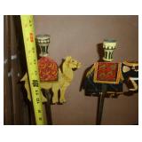 Lot of unique international items, 2 tall metal candle holders, wood carved man on a donkey, and 4 dolls.
