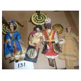 Lot of unique international items, 2 tall metal candle holders, wood carved man on a donkey, and 4 dolls.