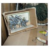 Old fishing items, box of heavy weighted hooks, net and minnow bucket, lures.  The bottom left red and white lure is an old wood one.