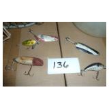 Old fishing items, box of heavy weighted hooks, net and minnow bucket, lures.  The bottom left red and white lure is an old wood one.
