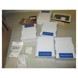 lot of call center headsets , earbu...