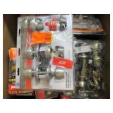 Box of door knobs and handles, open...