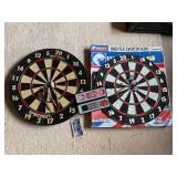 2 Dart Boards With Darts