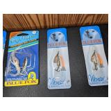 Lot of (11) New Fishing Lures and (1) New Daiwa Long Cast Reel