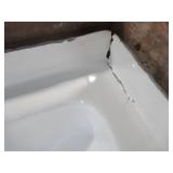 Aquatic Capistrano 60" x 30" x 20 5/8" Acrylx Applied Acrylic Left Drain Rectangular Apron Front Non-Whirlpool Bathtub in White - Crack on tile flange RH Corner. Cracked Wainscot LH Back Corner.