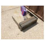 Lawn tractor weight with mounting bracket. As shown.