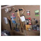 Lot Of Items On Peg Hooks: Hand Saws, Sand Paper, Tape, Hardware & Misc.