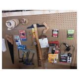 Lot Of Items On Peg Hooks: Hand Saws, Sand Paper, Tape, Hardware & Misc.