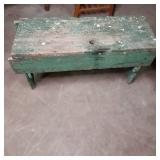 Green painted wood vintage bench. A...