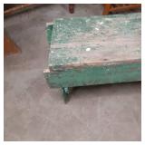 Green painted wood vintage bench. A...