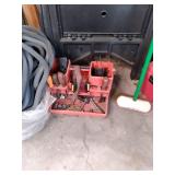 2 saw horses, bin of tools, and emp...