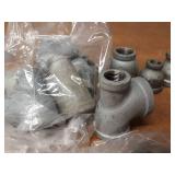 Lot of (48) Steel Pipe Fittings - (24) 1" Plugs, (2) 3/4" Street Elbows, (13) 1" Bushings, (7) 1" x 1" x 1/2" Tees, (2) 1" Unions