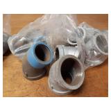 Lot of (23) Steel Pipe Fittings - (7) 2" Couplers, (5) 2" 45° Street Elbows, (5) 2" 90° Elbows, (6) 2" 45° Elbows
