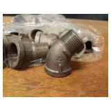 Lot of (61) Steel Pipe Fittings - (23) 1" 45° Street Elbows, (24) 1" Couplers, (14) 1-1/4" x 1/2" Reducing Couplers