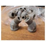 Lot of (89) Steel Pipe Fittings - (20) 3/4" 45° Elbows, (21) 3/4" 45° Street Elbows, (29) 3/4" x 1/8" Bushings, (9) 3/4" x 1/4" Bushings, (10) 3/4" x 1/2" Bushings