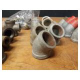 Lot of (38) Steel Pipe Fittings - (8) 1-1/4" x 1/2" x 1-1/4" Tees, (9) 1-1/4" 45° Elbows, (9) 1-1/4" 45° Street Elbows and More