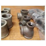 Lot of (49) Steel Pipe Fittings - (16) 1-1/4" 45° Elbows, (9) 1-1/4" x 1/2" x 1-1/4" Reducing Tees, (6) 1-1/4" 90° Street Elbows, (15) 1-1/4" Couplers and More