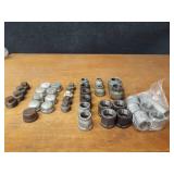 Lot of (39) Steel Pipe Fittings - (11) 1-1/4" Couplers, (2) 1-1/4" Unions, (6) 1-1/4" x 1" Reducers, (2) 1-1/4" x 1/2" Reducers, (5) 1-1/4" Plugs, (9) 1-1/4" Caps, (4) 1-1/2" Plugs